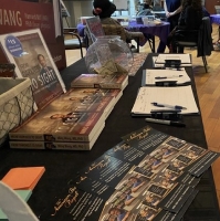 Dr. Wang, president of the Founders Club of the American Bible Project, displayed info about ABP