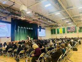 Audience with Dr. Ming Wang on stage 