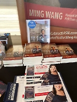 Dr. Wang, president of the Founders Club of Lady Up America, displayed info about LUA