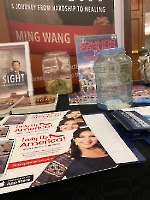 Dr. Wang, president of the Founders Club of Lady Up America, displayed info about LUA