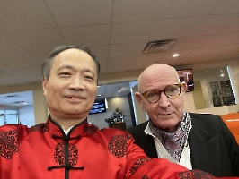 Dr. Wang poses with pianist, Doug Gortner