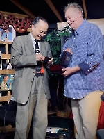 Kevin giving Dr. Wang gift