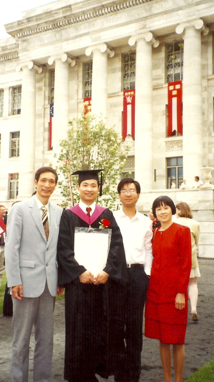 6 4. With my parents and brother Ming yu at gradu
